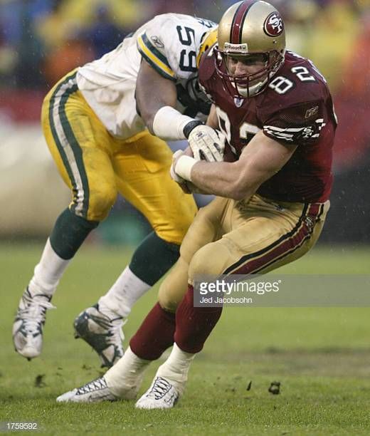 Tight end Eric Johnson of the San Francisco 49ers holds the ball___