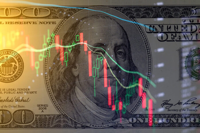 One hundred dollar bill on the background of stock charts. Economic crisis.